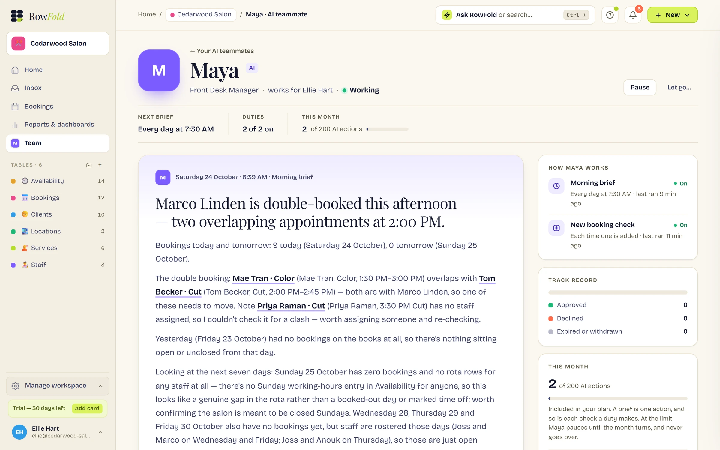 Maya's desk at Cedarwood Salon. Her morning brief leads with: Marco Linden is double-booked this afternoon, two overlapping appointments at 2:00 PM. Beside it, how she works: a morning brief every day at 7:30 AM and a check on each new booking.